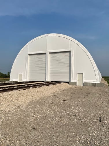 large fabric building with double doors